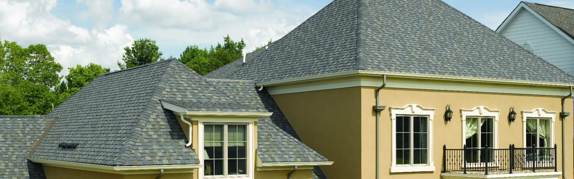 A house with a roof that has been covered in shingles.