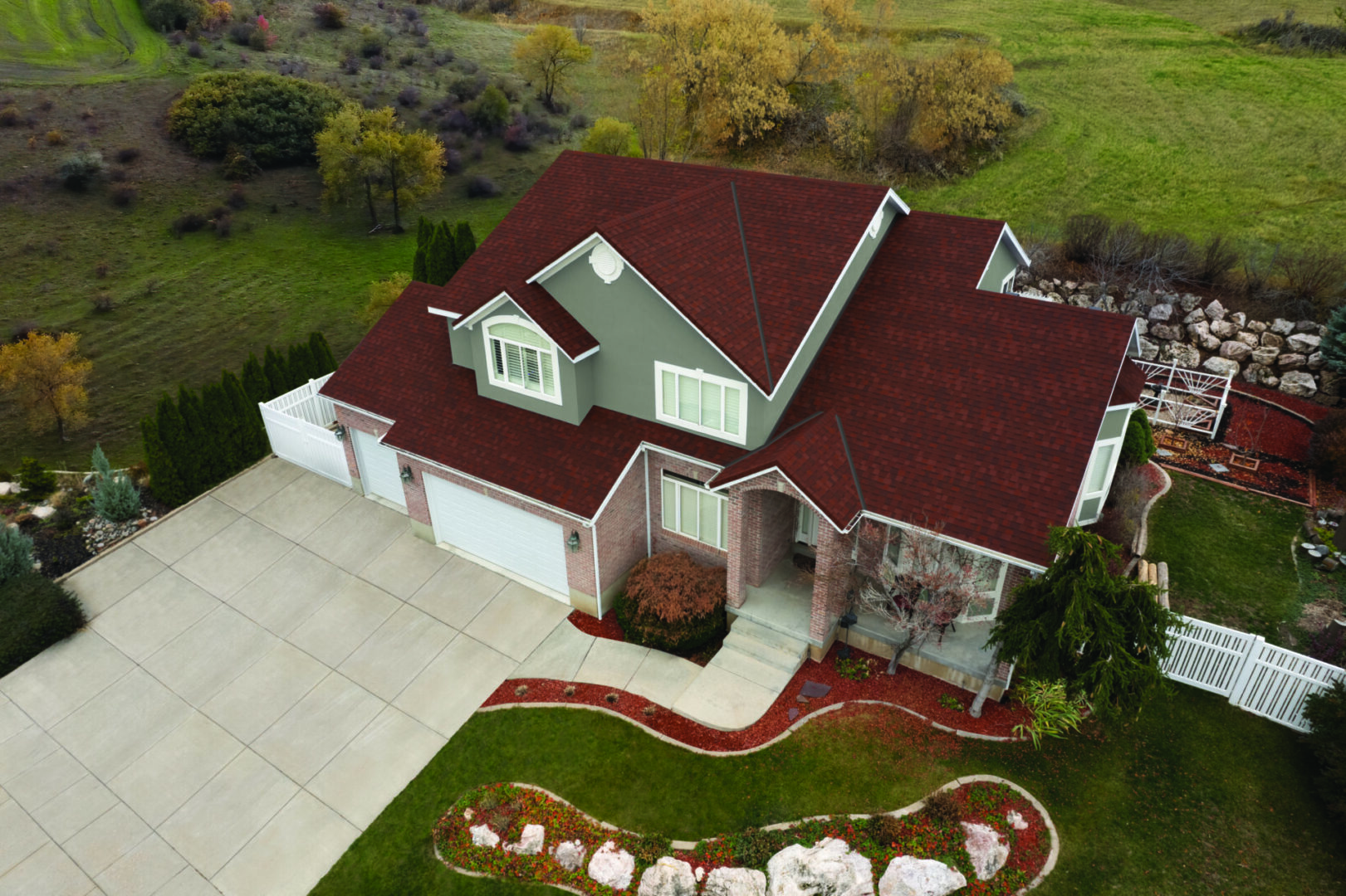 A large house with red roof and white trim.