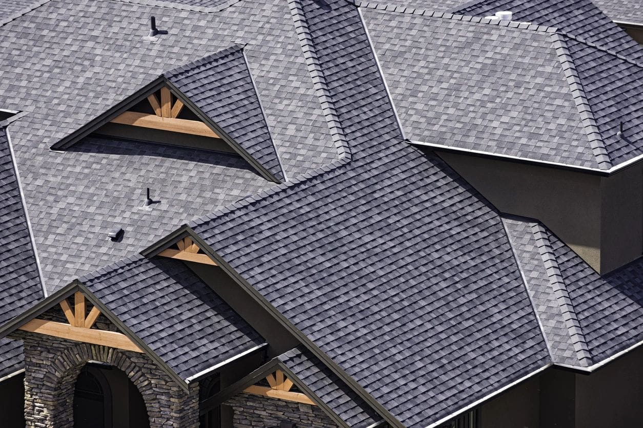 A close up of some houses with their roofs